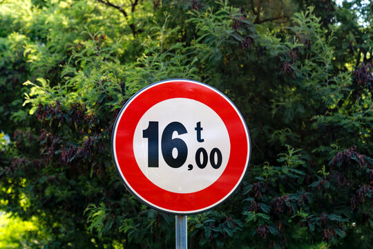 Close-up of circe shaped red and white road sign weight limit of 16 tonnes at Italian City of Meran on a sunny summer day. Photo taken July 16th, 2024, Meran Merano, Italy.