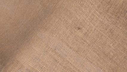 Natural hessian beige textile texture. Linen fabric backdrop. Rough burlap texture, canvas coarse cloth, dark brown woven rustic bagging. 