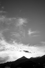clouds over the mountains at sunset: black and white version