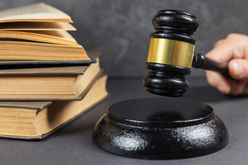 Law theme, lawyer's desk. Judge gavel on legal books