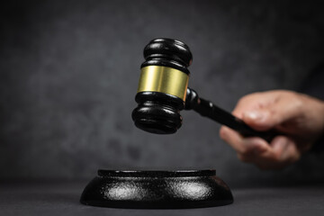 Judge hitting Gavel off a block in courtroom, law and Justice concept