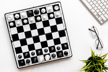 Leadership and business strategy concept. Chess board on office table, top view