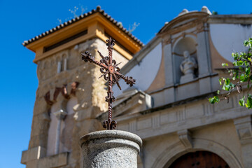 Fototapeta premium Iron Cross in Front of Historic Chapel in Cordoba, Spain
