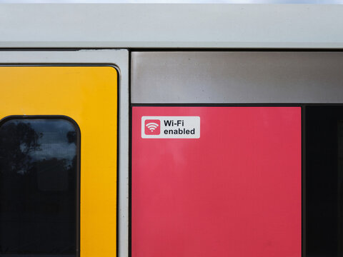 Close-up of train carriage with "Wi-Fi enabled" sign