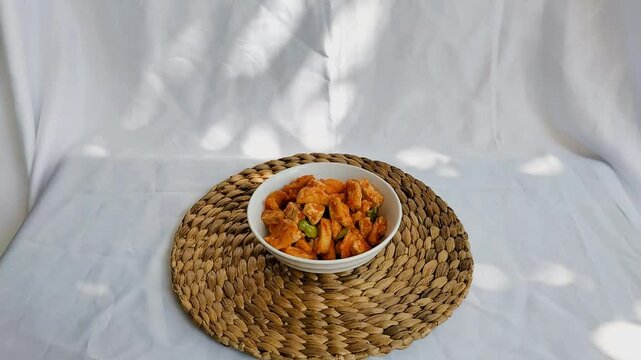 Close-up. Balado chili with a mixture of tofu and pete with white plate for lunch. 
