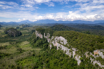 Fototapeta premium Limestone hills and caves in Merapoh, Malaysia
