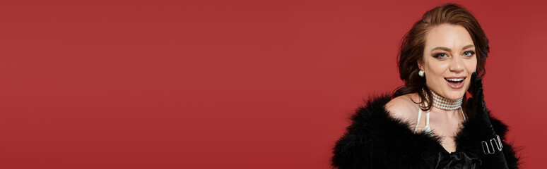 The elegant woman exudes confidence and grace, showcasing her stunning outfit with pride.