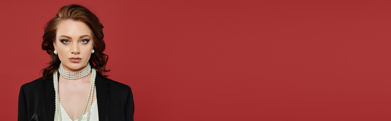 A beautifully dressed young woman exudes confidence and elegance in a striking setting.