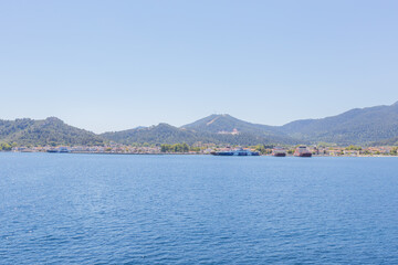 Ferry port at Thasos Island, Greece, with ferries docked and scenic mountain views in the background