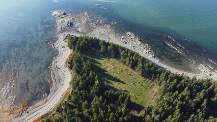 Panoramic aerial view of Leggatt's Point Presbyterian Church Cemetery and the Dead Men's Cove rocky reefs in Saint Lawrence River, Quebec,Canada.