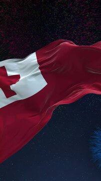 Tonga flag - Waving flag on celebrating fireworks for national holiday day. Ceremony for patriotic celebration of nation