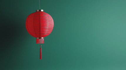 Obraz premium Red Chinese Lantern Hanging Against a Green Background