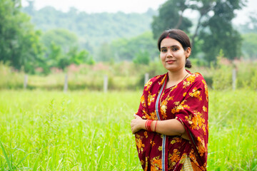 Indian woman standing in agriculture field