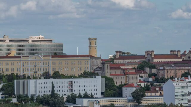 Aerial timelapse panorama of Lisbon city center with old prison (Estabelecimento Prisional de Lisboa), Colegio Almada Negreiros and Palacio da Justica. Located near Eduardo VII park. Portugal