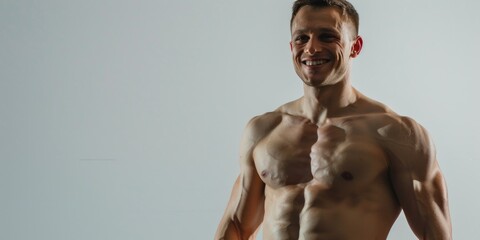 This image features a muscular male athlete showcasing his well-defined physique. He appears to have an impressive build, likely resulting from regular exercise and healthy living.