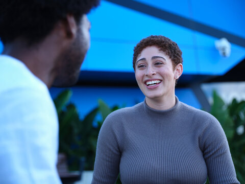 Man and woman having a conversation outside
