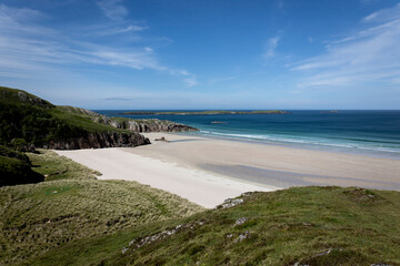 Beautiful sandy beach on the northwest coast of Scotland called Sandwood bay, on a sunny summer day.