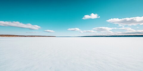 Obraz premium A serene winter landscape capturing the tranquility of frozen waters under a clear blue sky
