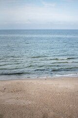 The coastline of the Baltic Sea in northern Poland features stunning sandy beaches, picturesque dunes, and lush greenery, offering a serene escape for nature lovers and beachgoers.