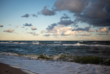 The coastline of the Baltic Sea in northern Poland features stunning sandy beaches, picturesque dunes, and lush greenery, offering a serene escape for nature lovers and beachgoers.