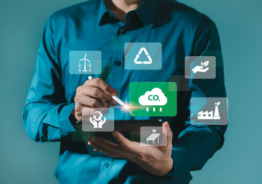 Reduce CO2 emissions Humans use software to reduce CO2 emissions to limit global warming and climate change for the environment, global warming, sustainable development and green business.