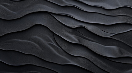 Fototapeta premium Abstract textured black leather surface with wavy patterns creating a sense of movement and depth, emphasizing the luxurious and elegant quality of the material.