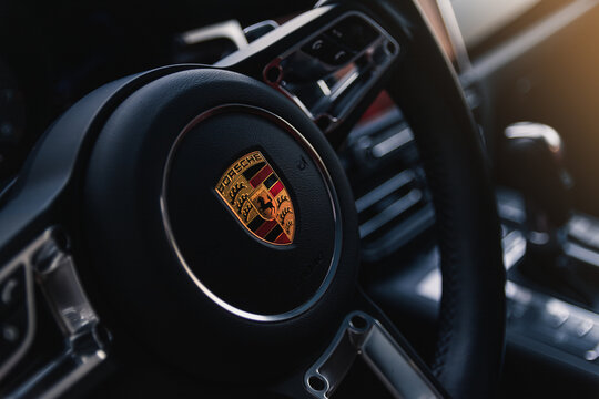 SUV Porsche Macan interior and steering wheel. Kyiv, Ukraine - September 2024.