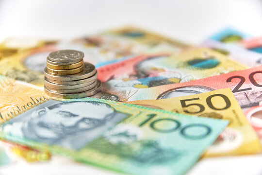 Collection of Australian banknotes and coins scattered on a flat surface