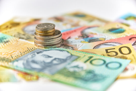 Collection of Australian banknotes and coins scattered on a flat surface