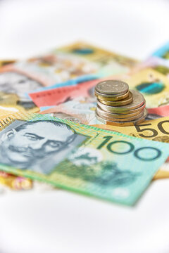 Collection of Australian banknotes and coins scattered on a flat surface