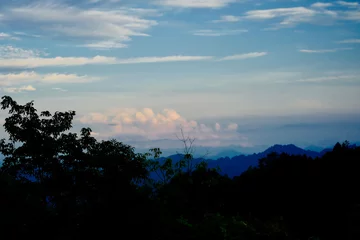 A nice view of blue sky mountains and clouds