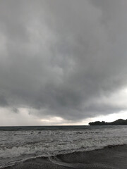 black clouds on a beach