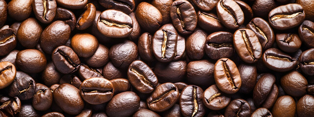Obraz premium Creative coffee banner wallpaper, seamless pattern texture - Top view of brown roasted coffee beans