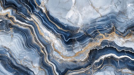 Fototapeta premium Beautiful abstract marble texture with swirling patterns in shades of blue, gray, and gold. Perfect for background or design projects.