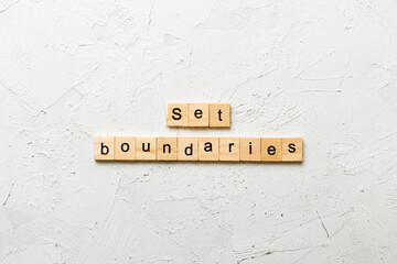 set boundaries word written on wood block. set boundaries text on table, concept