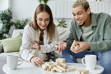 Two friends joyfully engage in a game while sharing laughter and conversation.