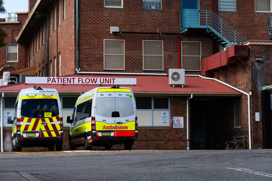 Ambulance patient transport vehicles parked at hospital Patient flow unit