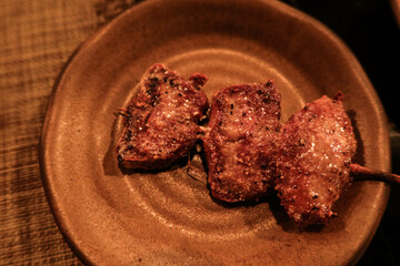 close up of Japanese grilled ox beef tongue skewer on a plate