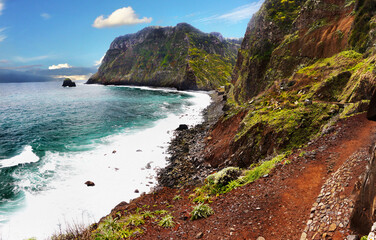 Obraz premium Sea coast and volcanic red rocks. Coastal landscape of Madeira island