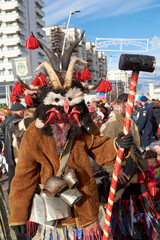 Obraz premium Bacau, Romania, December 2023, people dressed in impressive masks and costumes at the Bacau Festival of Dances and Customs