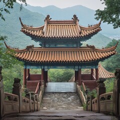 Naklejka premium Entrance to ancient mountain temple with traditional architecture among lush green foliage.