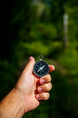 tourist compass in hand in the summer forest © Павел Чигирь