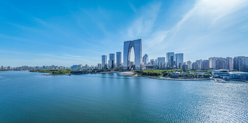 Modern city commercial buildings skyline and lake in Suzhou, China