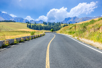 Empty asphalt road and mountains nature scenery in Xinjiang