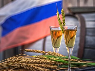 Naklejka premium Celebrate National Vodka Day with Golden Vodka and Wheat in a Toasting Scene