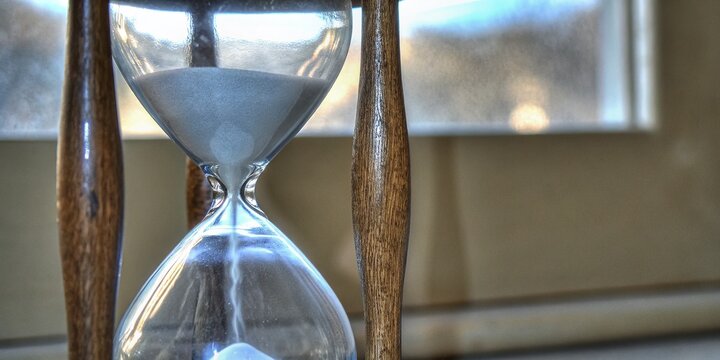 Closeup of Sand in Hourglass Symbolizing Time's Passage and Countdown to 2018 End