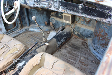 Vintage Car Interior With Worn Upholstery and Old Dashboard