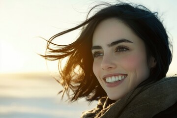Fototapeta premium Portrait of a Woman Smiling with Windblown Hair
