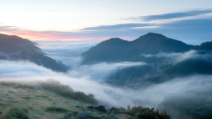 Sunrise Over Misty Mountains A Tranquil Scene with Rolling Clouds and Green Hills