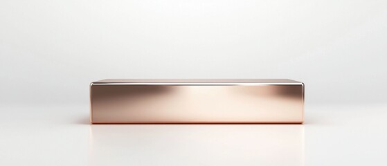 Obraz premium A gold colored box sits on a white background